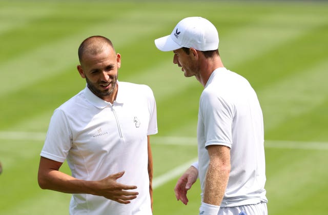 Dan Evans, left, and Andy Murray at Wimbledon last year