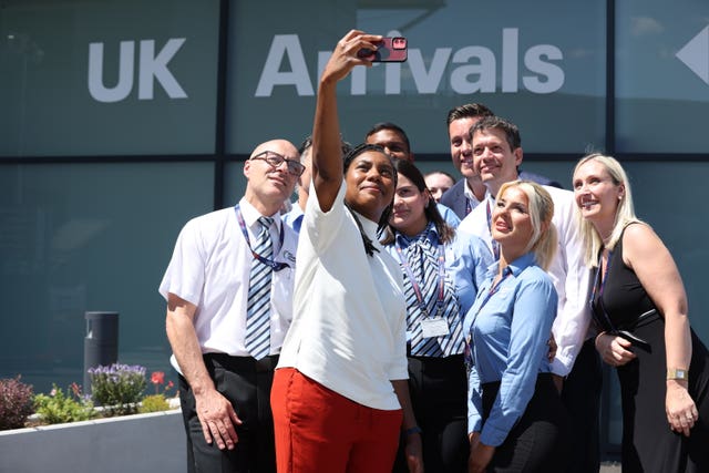 Kemi Badenoch takes a selfie with staff at Stansted
