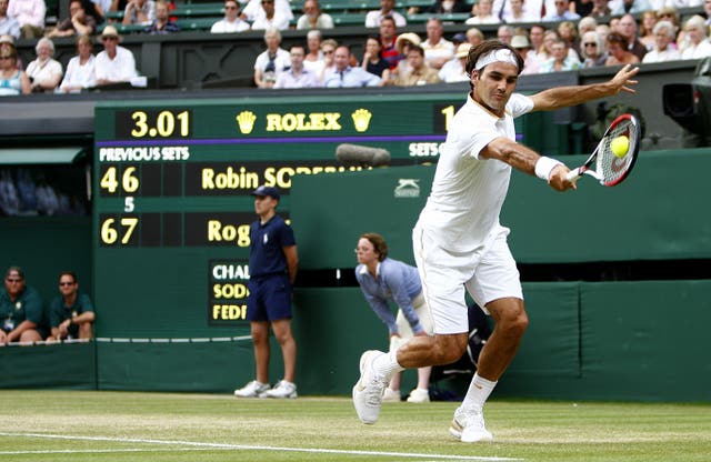 Roger Federer hits a backhand in 2009 on Centre Court