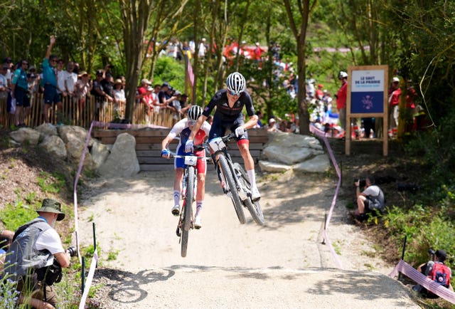 Tom Pidcock chases down Victor Koretzky in the race.