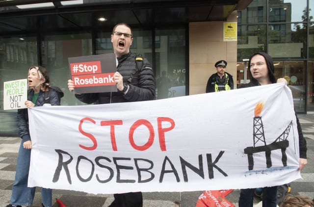 Campaigners take part in a Stop Rosebank protest outside the UK Government building in Edinburgh in September 