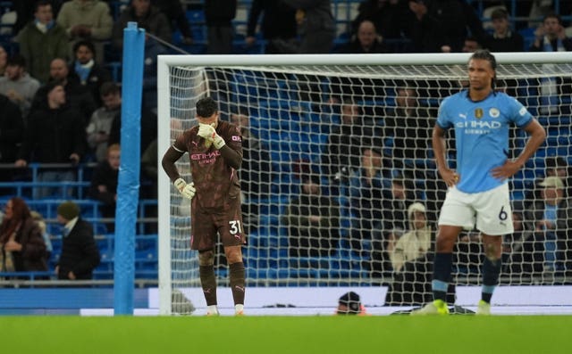 Manchester City goalkeeper Ederson appears dejected after conceding a goal against Tottenham