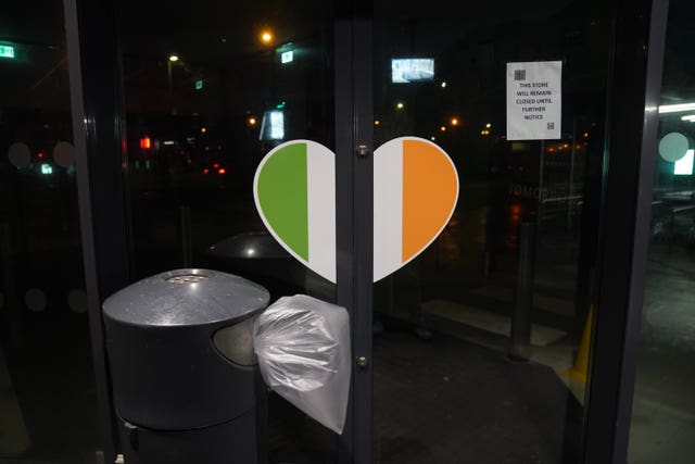 A sign advising customers of a shop closure on the door of the Lidl store in Finglas, Dublin