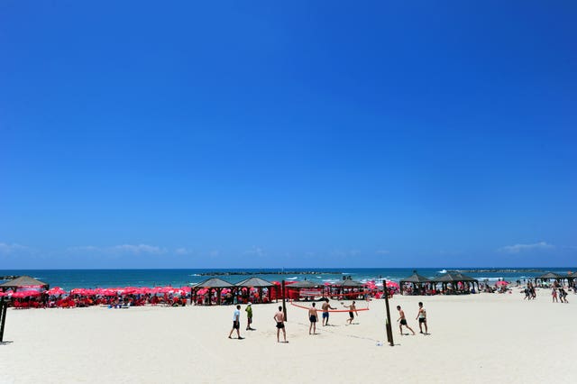 Beach volleyball on one of Tel Aviv’s beaches (Adam Davy/PA)