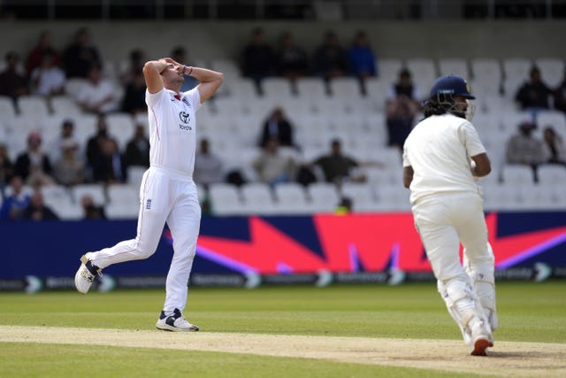 Josh Tongue (left) reacts as India’s KL Rahul runs past