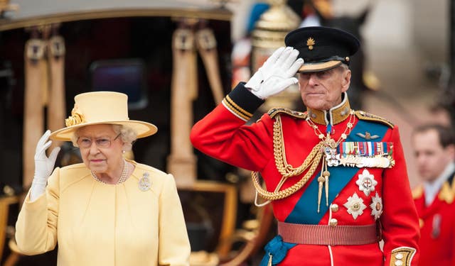The Queen and the Duke of Edinburgh inspecting troops 