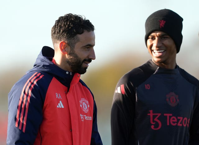 Manchester United manager Ruben Amorim with Marcus Rashford during a training session at Carrington