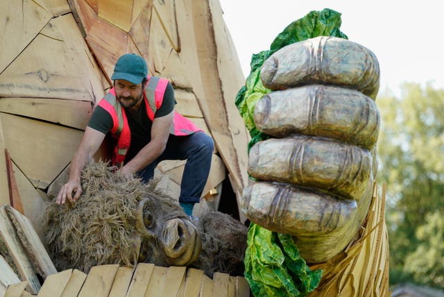 Dan McGavin, Design Director from Bakehouse Factory, inspects a giant interactive gorilla sculpture ‘Wilder’, during it’s unveiling to mark the final opening weeks of Bristol Zoo Gardens in Bristol. Picture date: Thursday July 21, 2022