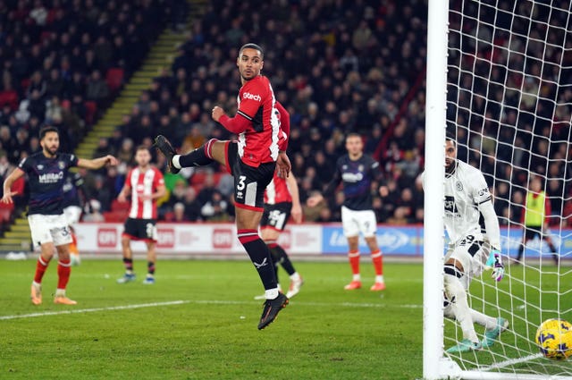 Sheffield United’s Max Lowe and goalkeeper Wes Foderingham look on after team mate Anis Slimane scored an own goal