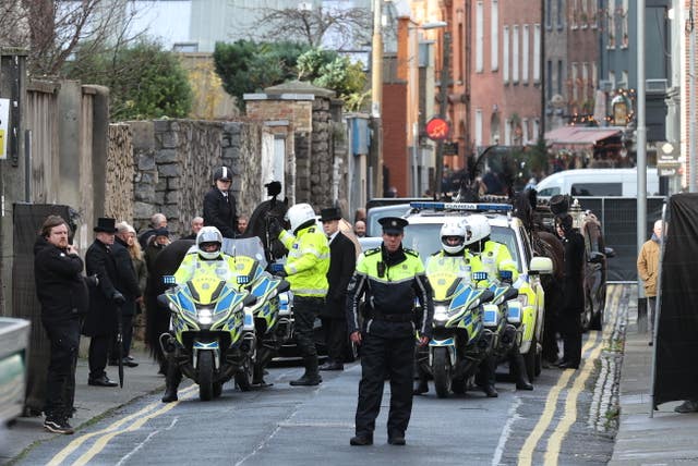Shane MacGowan's coffin being driven from Dublin to Co Tipperary, for the funeral, after the horse-drawn carriage procession in the capital