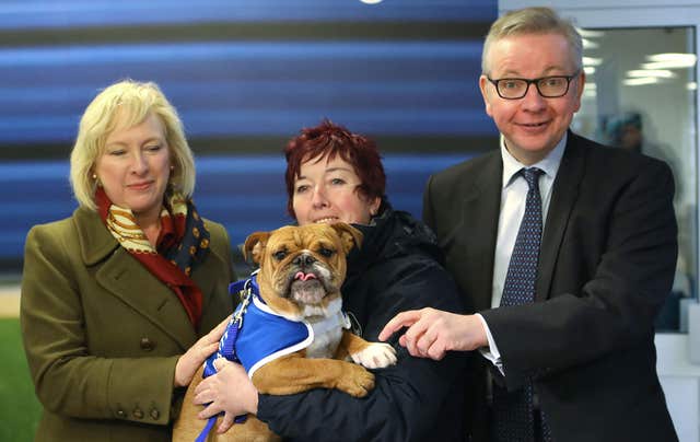 Environment Secretary Michael Gove (right) with Chief Executive Claire Horton (left) and Head of K9 behaviour Ali Taylor holding Enid the Bulldog during a visit in December to Battersea Dogs and Cats Home in London where he announced the plans for new animal welfare laws 