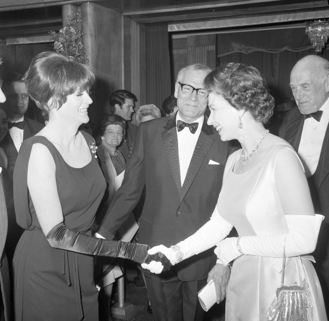 Dame Maggie with Lord Laurence Olivier and Queen Elizabeth II