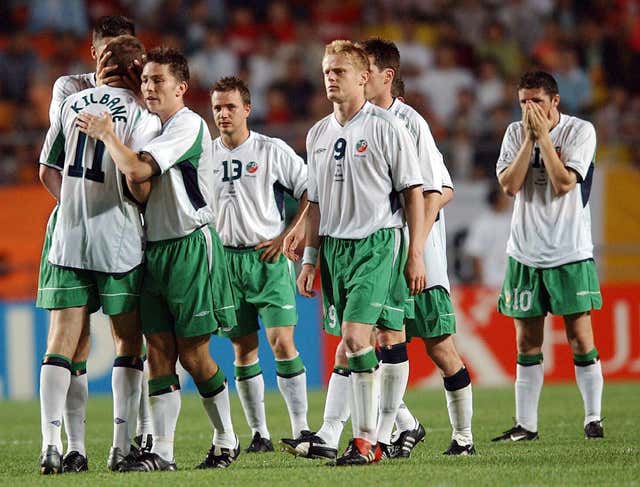 Republic of Ireland’s Kevin Kilbane (number 11) is consoled by team-mates after missing a penalty against Spain in Suwon at the 2002 World Cup finals