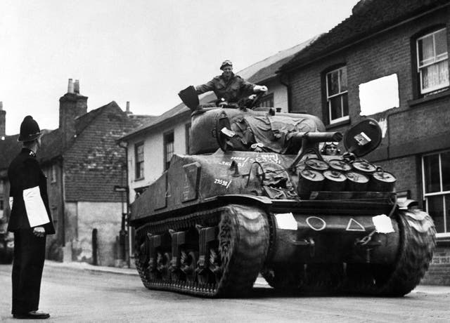 A British Army Sherman Tank rumbles down a street on its way to a south coast port prior to the Normandy D-Day landings. PA Wire