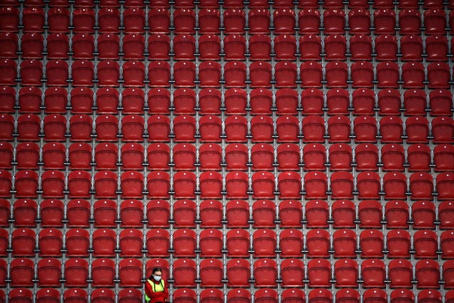 A ball girl sits alone in the stands during Rotherham's home Sky Bet Championship match against Coventry