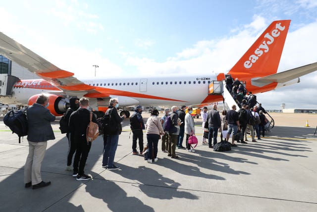 Passengers prepare to board an easyJet flight to Faro, Portugal (Gareth Fuller/PA)