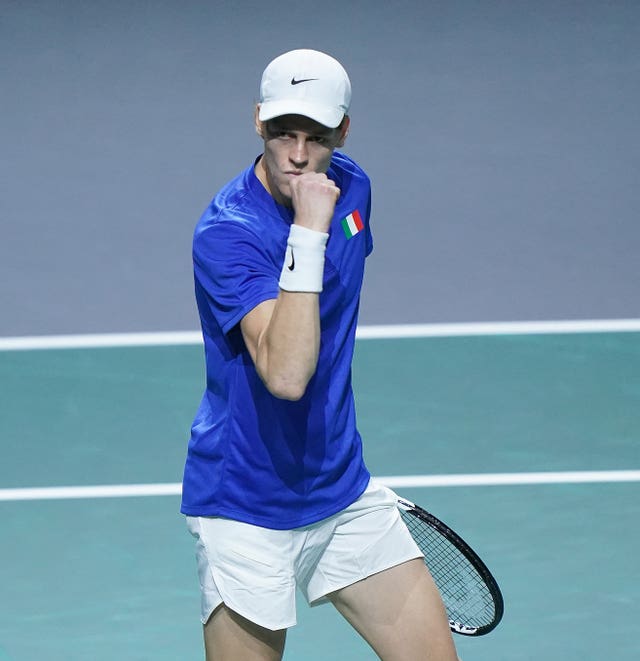 Jannik Sinner clenches his fist during his remarkable singles win