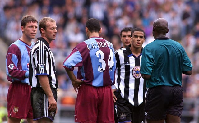 Shearer is about to be sent off by Uriah Rennie for clashing with Calderwood
