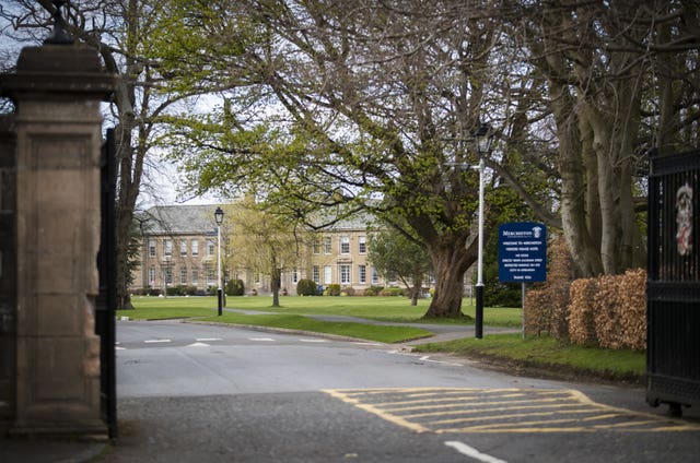 The gates to Merchiston Castle School, with the building in the background