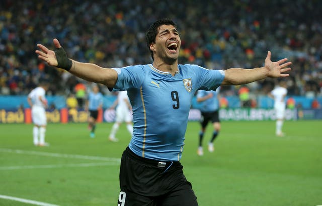 Luis Suarez celebrates breaking English hearts in Brazil
