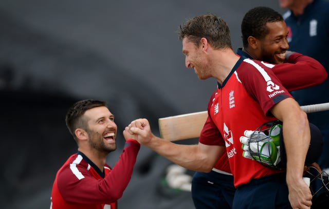 Jos Buttler, right, is congratulated by Mark Wood after guiding England to victory over Australia in the second Twenty20 international at the Ageas Bowl 