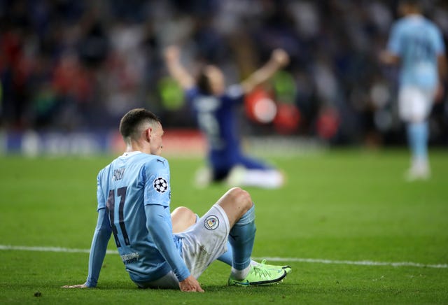 Phil Foden appears dejected at the final whistle after defeat to Chelsea in the Champions League final 