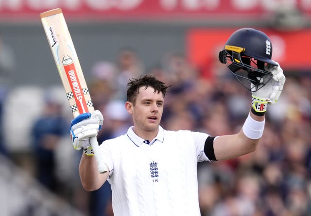 Jamie Smith celebrates making a hundred