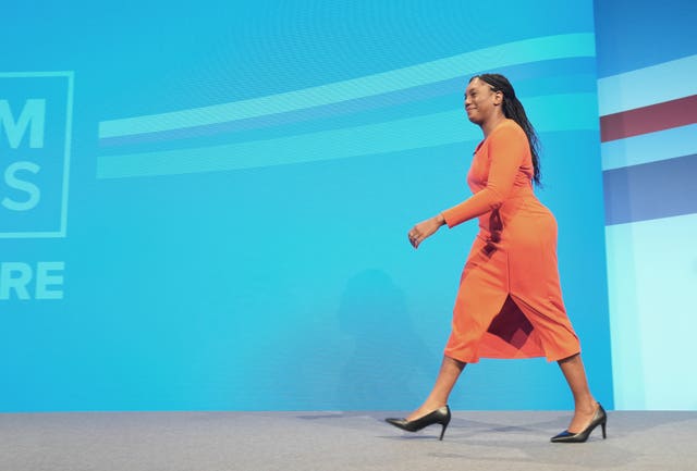 Business Secretary Kemi Badenoch makes her way to the stage to deliver a speech during the Conservative Party annual conference at the Manchester Central convention complex