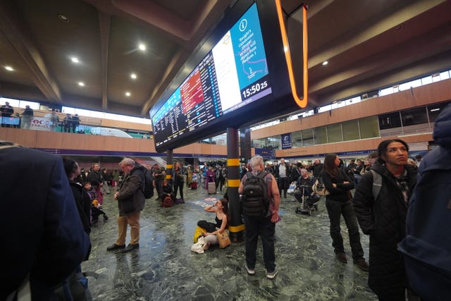 People at Euston station after severe disruption because of a signalling fault at the station