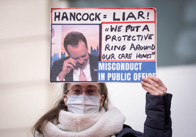 A person holds up a sign during the demonstration