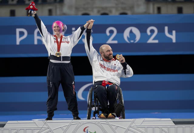 Jodie Grinham and Nathan Macqueen celebrate with their gold medals