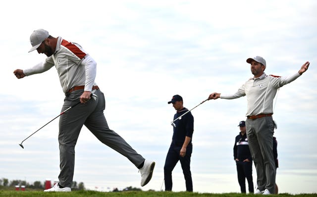 Jon Rahm and Sergio Garcia celebrate 