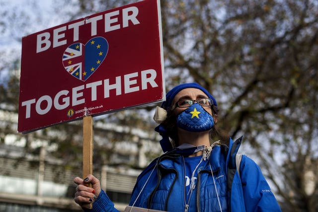 An anti-Brexit demonstrator holds a sign saying 'Better Together'