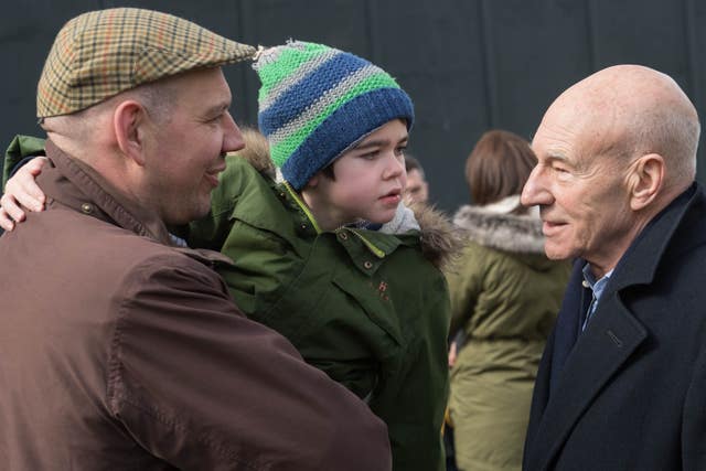 Six-year-old Alfie Dingley and his father Drew Dingley with Sir Patrick Stewart