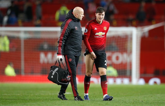 Victor Lindelof, right, limps off after United's draw with Crystal Palace