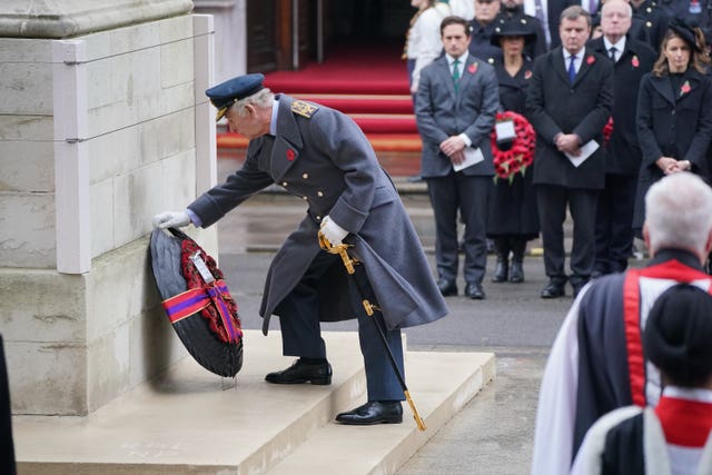 The King lays a wreath during the Remembrance Sunday service last year 