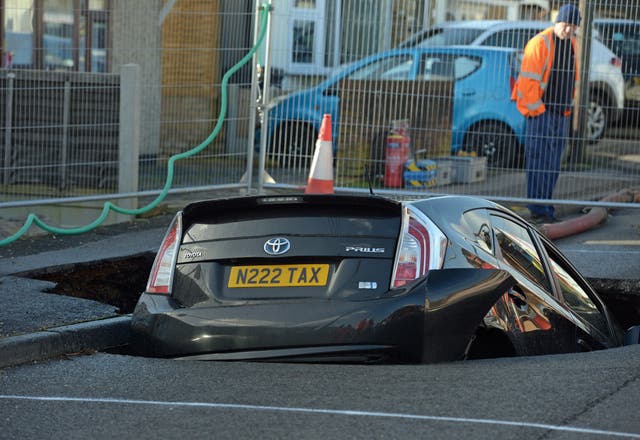 A car in a sinkhole