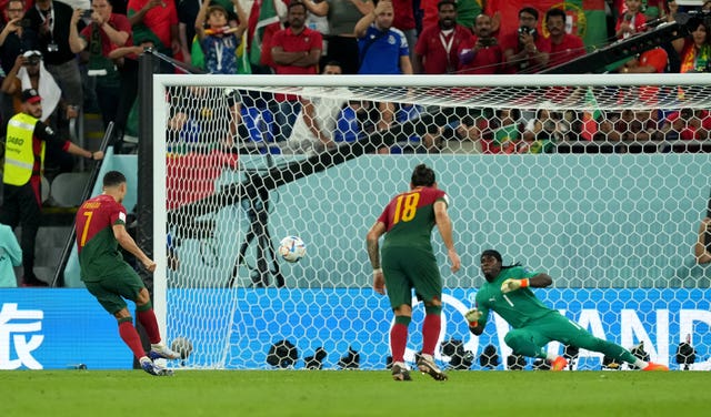 Portugal’s Cristiano Ronaldo scores the opening goal against Ghana
