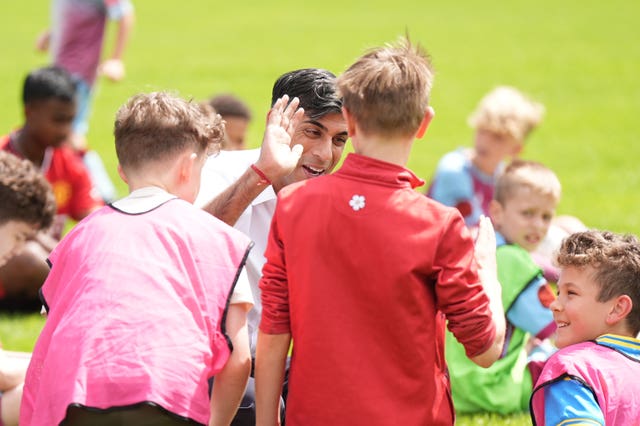 Rishi Sunak carried out some high fives while meeting youngsters