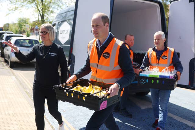 William carrying a tray of bananas as he delivers supplies from Surplus to Supper