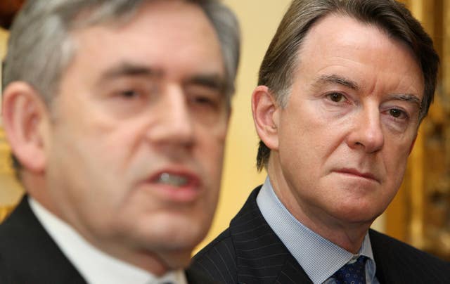 Lord Mandelson looks on as Gordon Brown delivers a speech