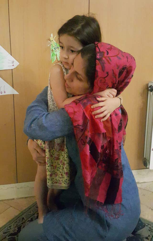 Ms Zaghari-Ratcliffe hugs her young daughter Gabriella goodbye (The Free Nazanin campaign/PA)