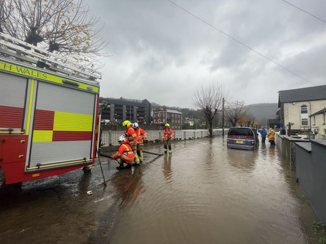 Firefighters pumping water from Sion Street by the River Taff in Pontypridd