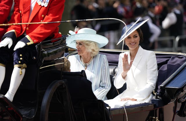 The Duchess of Cornwall and the Duchess of Cambridge ride in a carriage 