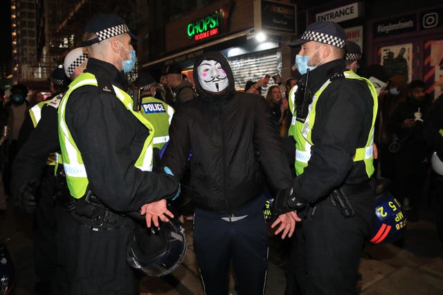 Police detain a protester 