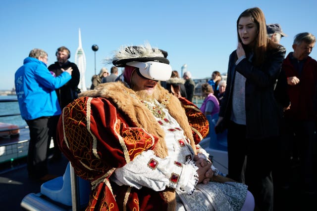 A Henry VIII interpreter wears a VR headset