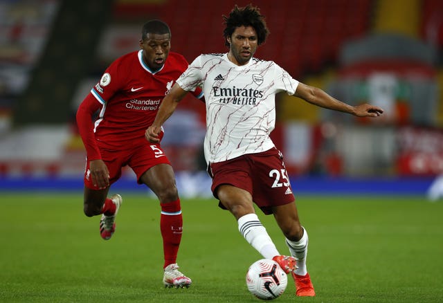 Arsenal midfielder Mohamed Elneny (right) is in quarantine following another positive Covid-19 test