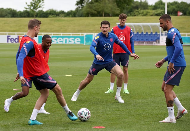 Harry Maguire (centre) joins in training with his England team-mates 