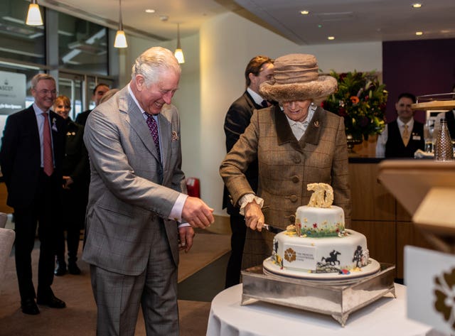 Charles and Camilla cutting cake