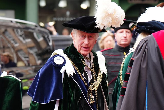 The King in his robe and ostrich-plumed hat arrives for the Order of the Thistle Service at St Giles’ Cathedral in Edinburgh on July 3